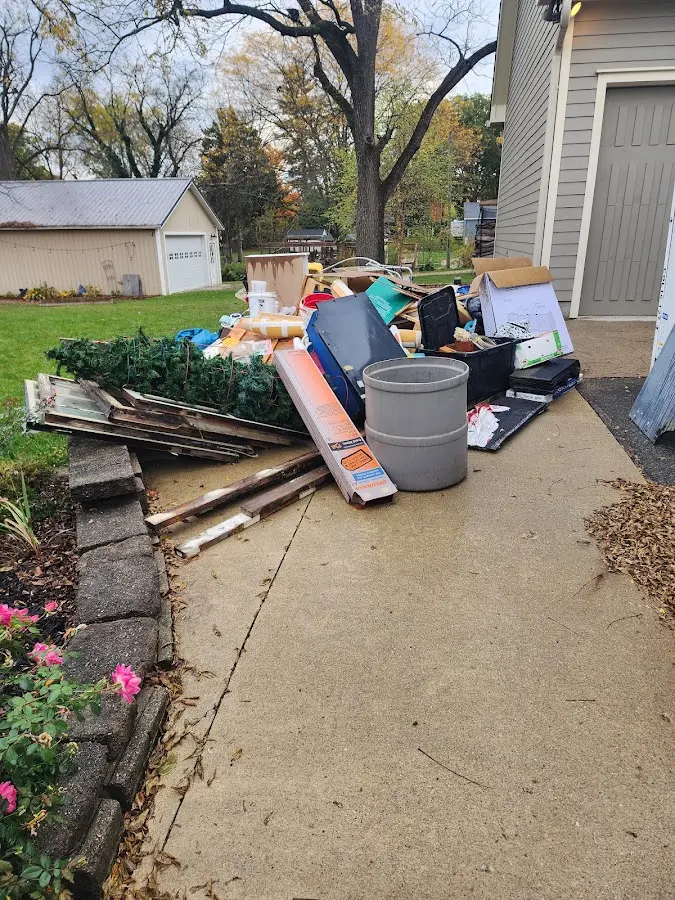 Dumpster being loaded with debris for Roofing Dumpster Rental in Gahanna
